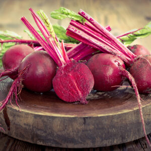 Red Beet roots on a wooden platform